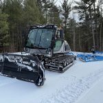 Brand new snow groomer for Central NH Snowmobile Club, enhancing trail maintenance for winter riders.