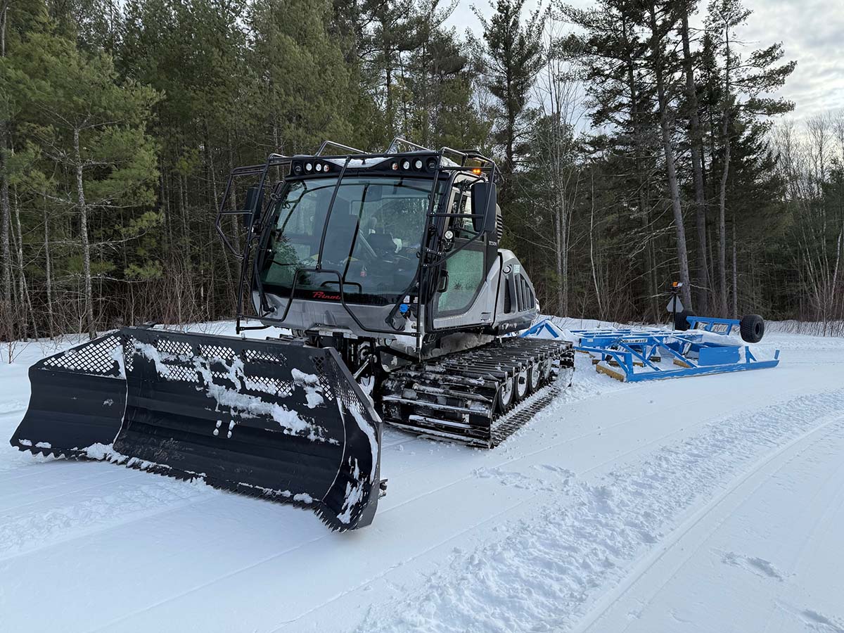 Brand new snow groomer for Central NH Snowmobile Club, enhancing trail maintenance for winter riders.