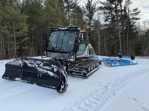 Brand new snow groomer for Central NH Snowmobile Club, enhancing trail maintenance for winter riders.